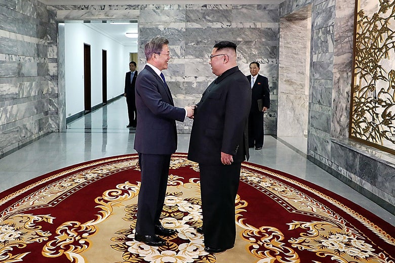 In this handout image provided by South Korean Presidential Blue House, South Korean President Moon Jae-in (L) shake hands with North Korean leader Kim Jong Un (R) before their meeting on May 26, 2018 in Panmunjom, North Korea.